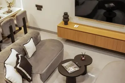a living room with a couch and a coffee table at New 2BR Architectural Masterpiece in Umalas in Kerobokan