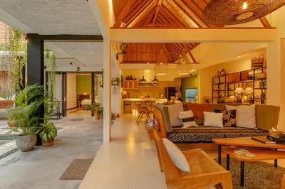 a living room with a couch and a table at Villa Mint Dua, Peaceful 3BR Villa - Near La favela Seminyak in Seminyak