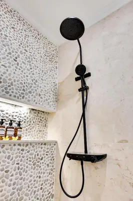 a shower in the corner of a bathroom at Villa Mawali in Legian