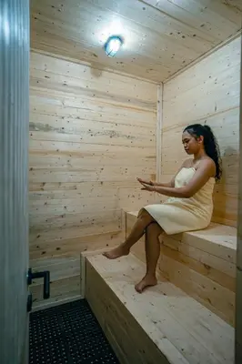 a woman sitting on the inside of a sauna at Amshiga 5 in Jimbaran