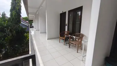 a balcony of a house with a table and chairs at Saphala Suites Secondfloor in Seminyak