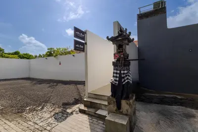 a street sign in front of a white wall at Villa Gael by Pertama Management in Seminyak