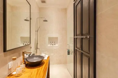 a bathroom with a sink and a shower at Villa Gael by Pertama Management in Seminyak
