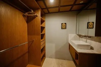 a bathroom with a sink and a mirror at UrbanVilla in Legian