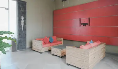 two chairs and a table in a room at Rishi Villas in Kerobokan