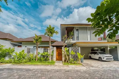 a house with a car parked in front of it at Natadesa Villa 3BR Family Villa in Jimbaran in Jimbaran