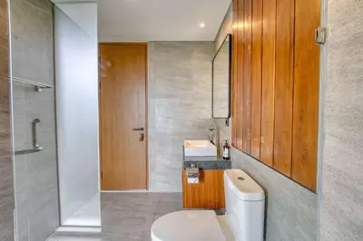 a bathroom with a toilet and a sink at Natadesa Villa 3BR Family Villa in Jimbaran in Jimbaran