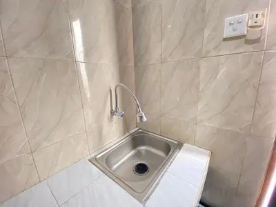 a bathroom with a sink in a shower at SG Hotel - 2 Minutes to the Beach By Micky Studio 2 in Legian