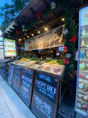 a food stand with a display of food on it at SG Hotel - 2 Minutes to the Beach By Micky Studio 2 in Legian