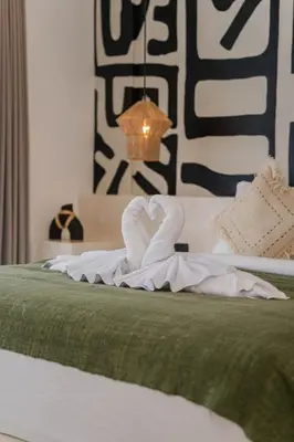 a swan made out of towels on a bed at Villa Aura - Spacious 1BR Private Pool Luxury Villa in Seminyak