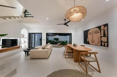 a living room with a table and a couch at Villa Aura - Spacious 1BR Private Pool Luxury Villa in Seminyak