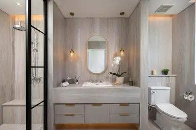 a bathroom with a sink and a toilet and a mirror at Colonial House 4BR Villa Ocean View in Berawa in Canggu