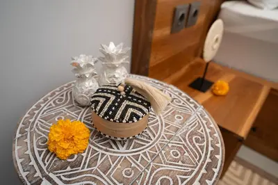 a table with a cake and flowers on it at Villa Bella Poppy in Seminyak