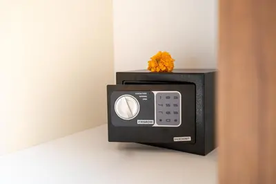 a small microwave with a flower on top of it at Villa Bella Poppy in Seminyak
