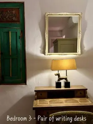 a lamp on a table in a room with a mirror at Villa Anh Yeu - 6 BR in Central Seminyak with Huge Pool & Garden in Seminyak