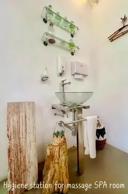 a bathroom with a sink and a dog in a room at Villa Anh Yeu - 6 BR in Central Seminyak with Huge Pool & Garden in Seminyak