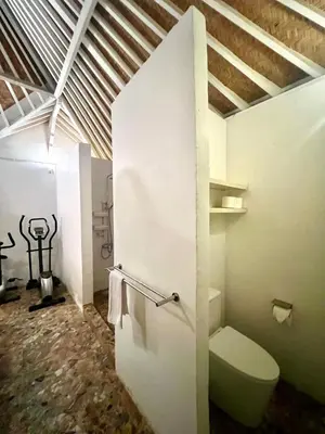 a bathroom with a toilet in a room at Villa Anh Yeu - 6 BR in Central Seminyak with Huge Pool & Garden in Seminyak