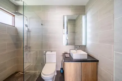 a bathroom with a toilet and a sink and a shower at Villa Sunset-Near Seminyak Pool Free Airport Xfer in Seminyak