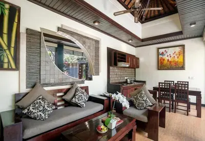 a living room with a couch and a table at Exquisite 3 BR Villa Seminyak CYN in Seminyak