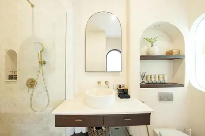 a bathroom with a sink and a mirror at Villa Arya 2 in Kerobokan