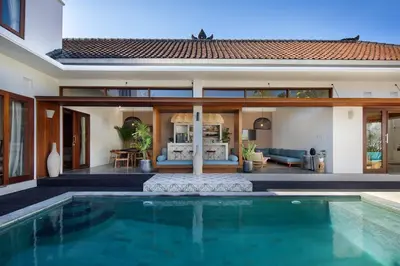 a villa with a swimming pool and a house at Gorgeous 6 beds, 14 pax in the heart of Seminyak in Seminyak