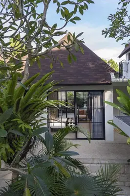 a house with a view of the back yard at Sophisticated Luxe Martini 1 - 1BR Villa in Kerobokan