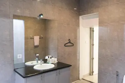 a bathroom with a sink and a shower at 3BR, 5Beds, 10ppl, Seminyak, BeachSide in Seminyak