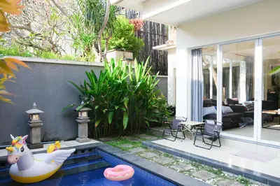 a house with a pool with a rubber duck in the yard at 3BR, 5Beds, 10ppl, Seminyak, BeachSide in Seminyak