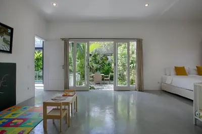 a living room with a couch and a table at Villa Pepita - Cosy 3bdrs villa, family friendly - Seminyak in Badung