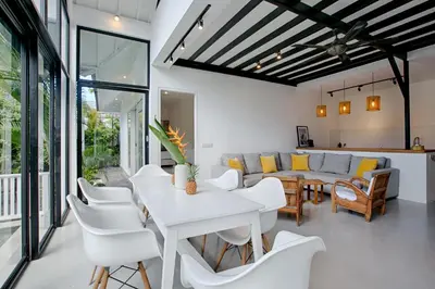 a living room with a white table and chairs at Villa Pepita - Cosy 3bdrs villa, family friendly - Seminyak in Badung