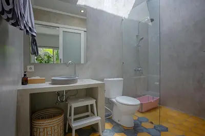 a bathroom with a shower and a toilet and a sink at Villa Pepita - Cosy 3bdrs villa, family friendly - Seminyak in Badung