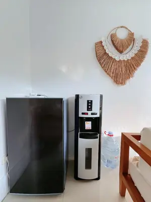 a kitchen with a refrigerator and a coffee maker at Rove Pool Villa Seminyak in Seminyak