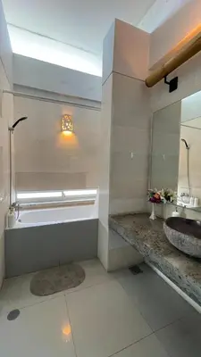 a bathroom with a sink and a mirror at Bougenvilla Nusa Dua Villa with Private Pool in Nusa Dua