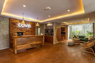 a lobby with a cave sign on the wall at Cove Renata in Seminyak