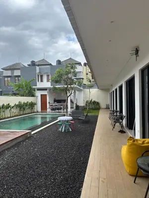 a patio of a house with a swimming pool at bali thousand island living - guest house in Pesanggaran