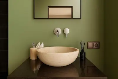 a bathroom with a large bowl sink on a counter at Ducat Living in Canggu