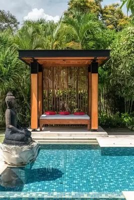 a gazebo next to a swimming pool at Beachfront Escape Villa in Ujung