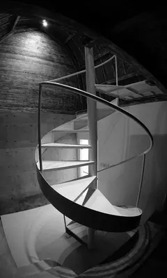 a spiral staircase in a building with a stair case at PROMO Private Vacation Rental Villa 2 Pools 4 Bedrooms 4 Bathroom Free Airport Pickup in Denpasar
