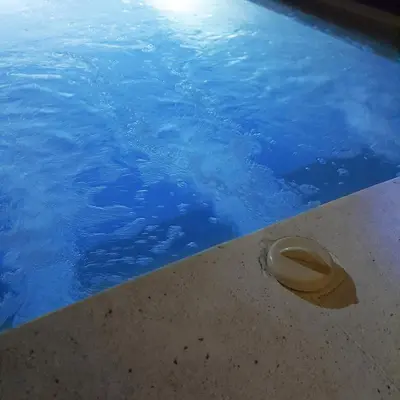 a hat sitting on the edge of a swimming pool at PROMO Private Vacation Rental Villa 2 Pools 4 Bedrooms 4 Bathroom Free Airport Pickup in Denpasar