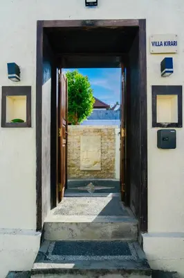 an open door to a building with a view of the ocean at Villa Kirari in Seminyak