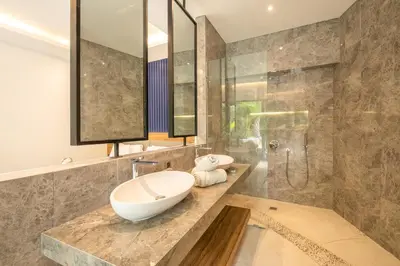 a bathroom with a sink and a shower at Luxury 3BR Modern Villa in the Heart of Seminyak in Seminyak