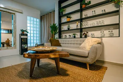 a living room with a couch and a coffee table at Amshiga 2 in Jimbaran