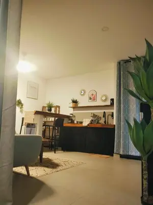 a living room with a couch and a table at Amshiga 2 in Jimbaran