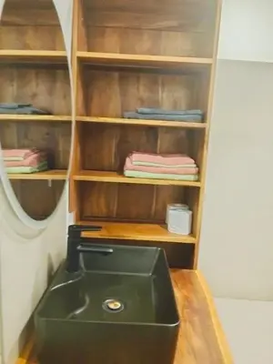 a bathroom with a sink and a mirror at Amshiga 2 in Jimbaran