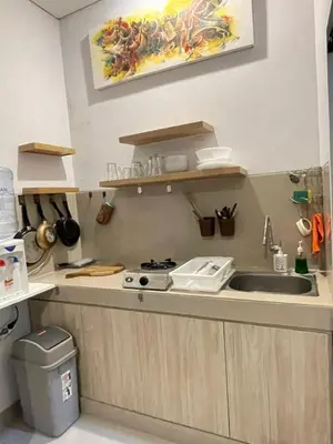 a kitchen with a sink and a counter top at Studio with rice field view in Kerobokan in Kerobokan