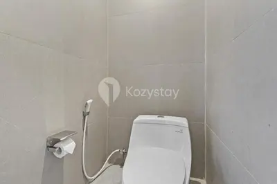 a bathroom with a toilet and a sign on the wall at deTasia Villa by Kozystay - Jimbaran in Jimbaran