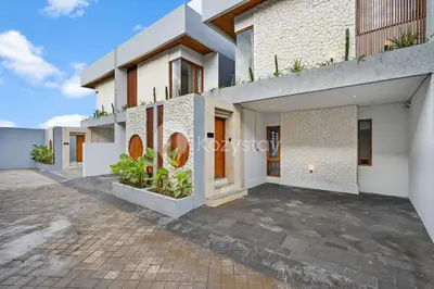 a facade of a house with a courtyard at deTasia Villa by Kozystay - Jimbaran in Jimbaran