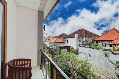 a balcony with a view of buildings at Collection O Bali Sanur near Bali Mandara Hospital in Sanur