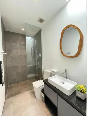 a bathroom with a toilet and a sink and a shower at Sunflower Bali Villa 3BR Legian Double Six Beach in Seminyak