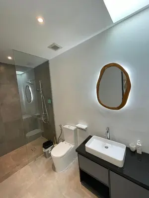 a bathroom with a toilet and a sink and a shower at Sunflower Bali Villa 3BR Legian Double Six Beach in Seminyak